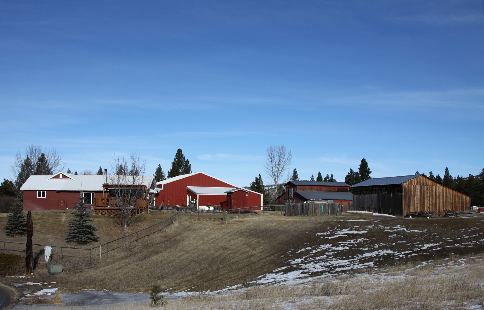 View of home, land and outbuildings