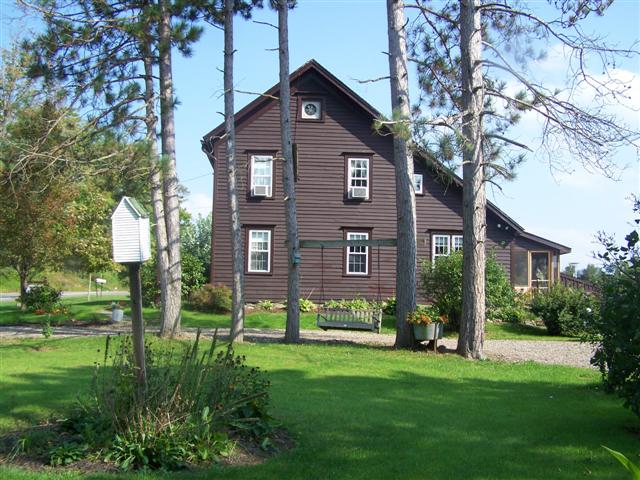 side of brown saltbox home