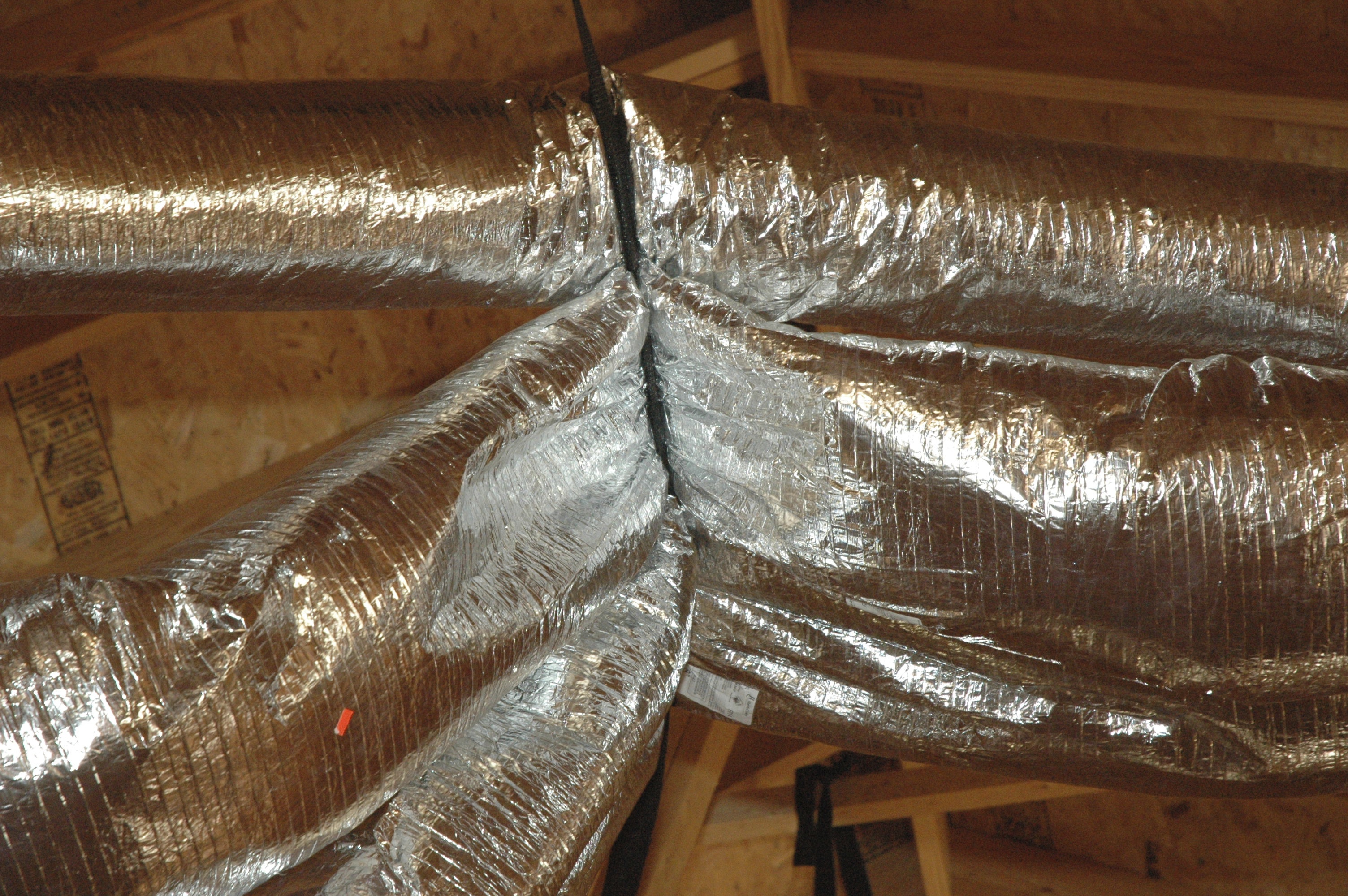 Plastic duct system that shows major bend that causes a air restriction and loss of heating and cooling in that line. Photo by Van Woody Realtor in Williamson County, TN. www.vanwoody.com