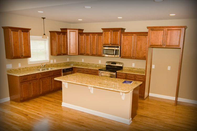 Cascading cabinets and granite countertops included in John Maher's homes. Agent for builder s Van Woody