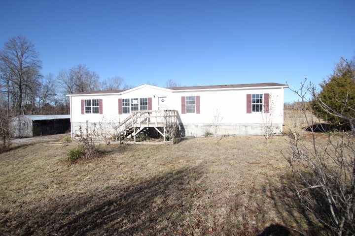 New Price 1990 Ike Adcock Road sitting 11.8 acres with large shop